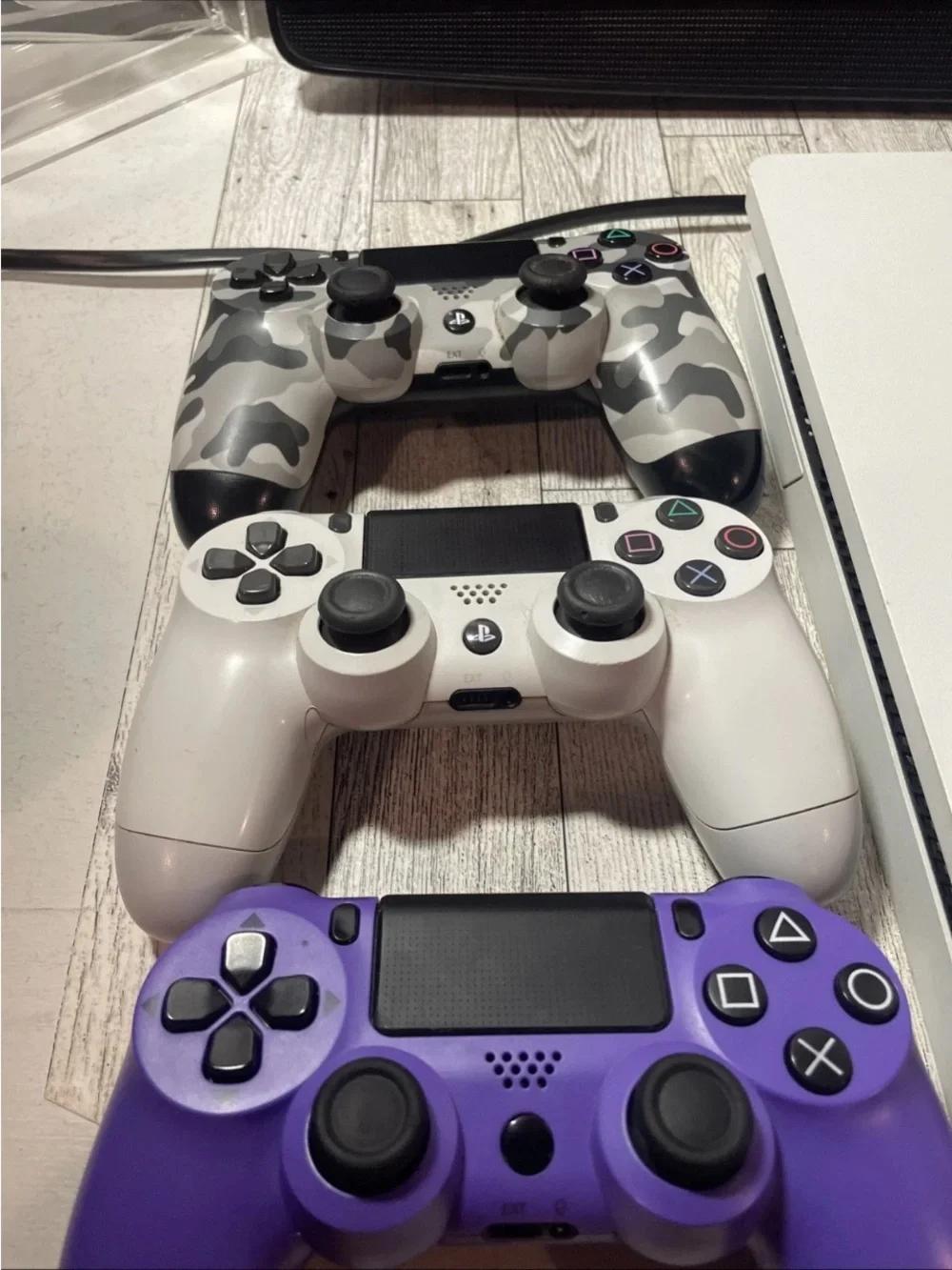 Sony White PS4 Slim with White, Purple and Camo Controllers